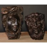 A 19th century oak wall boss or mask, carved in the Baroque manner as the head of a lady, 28.5cm