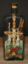 A 19th century softwood and decoupage bottle diorama, in the prisoner of war and sailor folk art