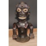 Tribal Art - an Ekoi leather figural headdress, probably depicting an ancestor, fibre trim to