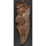 An Italian softwood carving, of a putto musician, serenading within the crescent moon, 31cm high