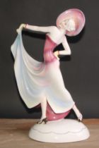 A large Katzhutte Art Deco figure, of a lady dressed a la mode, oval base, printed mark, 50cm high