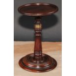 A George III mahogany adjustable table top candle stand, dished circular plateau, turned pillar