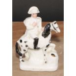 A late 19th century German porcelain inkwell, of fairing type, modelled as Napoleon Bonaparte on