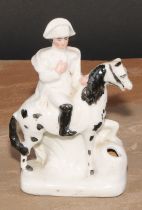 A late 19th century German porcelain inkwell, of fairing type, modelled as Napoleon Bonaparte on