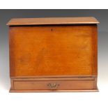 A late Victorian mahogany table top writing cabinet, hinged top and fall front enclosing a fitted