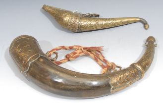 A 19th century Persian brass crescent shaped powder flask, engraved and chased with strapwork and