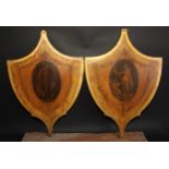 A pair of George III Neoclassical shield shaped screens, each transfer printed en grisaille with