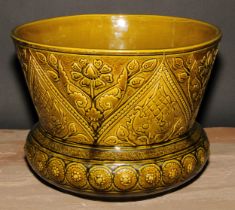A Burmantofts Aesthetic Movement art pottery jardiniere, moulded with stylised flowers, glazed in