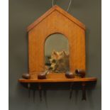 An early 20th century mahogany novelty hall pipe pipe rack, as a dog kennel, the arched mirror