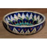 A Middle Eastern tin glazed bowl, decorated in the Iznik palette, 13cm diam, D & S Howlett