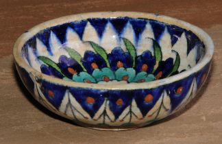 A Middle Eastern tin glazed bowl, decorated in the Iznik palette, 13cm diam, D & S Howlett
