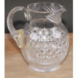 A 19th century hobnail-cut glass ovoid jug, possibly Irish, scroll handle, star-cut base, 17.5cm