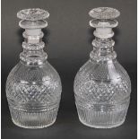 A pair of 19th century hobnail-cut mallet shaped decanters, mushroom stoppers, three neck rings,
