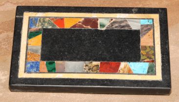 A pietra dura rectangular desk weight, inlaid with an irregular band of specimen stones, 14cm wide