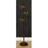 An unusual 19th century mahogany and brass adjustable floor standing candle stand, acorn finial,