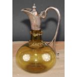 A late Victorian E.P.N.S mounted amber flashed glass ovoid claret jug, hinged cover above two