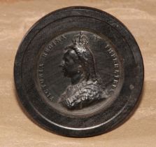 A Victorian bois durci royal commemorative roundel, in relief with a portrait bust of Queen