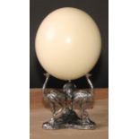 Natural History and the Cabinet of Curiosities - an ostrich egg, the silver plated triform base cast