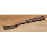 A fine William IV silver fruit fork, the sculptural handle cast and chased with putti and