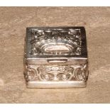 A Continental silver coloured metal pill box, hinged cover embossed with a crown, the sides with