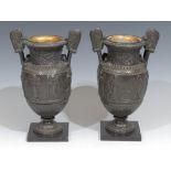 A pair of 19th century Grand Tour bronze urns, after Ancient Greek volute kraters, cast in bas