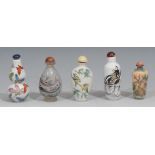 A Chinese porcelain cylindrical snuff bottle, painted in polychrome with a lady and boy in a