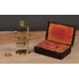 A George III lacquered brass travelling pocket microscope, square pillar, concave mirror, oval base,