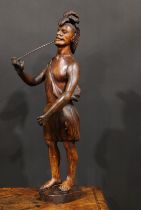 A 19th century carved tobacconists advertising figure as a native American, standing wearing