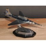 An Art Deco style chrome novelty table lighter, as a jet aeroplane, lozenge shaped base, 24cm long