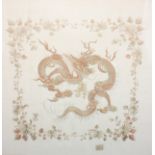 A Chinese needlework picture, worked in two-tone threads with a ferocious dragon, within a flowering