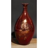 An Art Pottery ovoid vase, decorated in silver lustre with a clown on a red ground, 24cm high