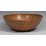 A 19th century turned treen dairy bowl, 24cm in diameter, c.1850