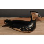 A painted softwood avian decoy, carved as a waterfowl, 28cm long