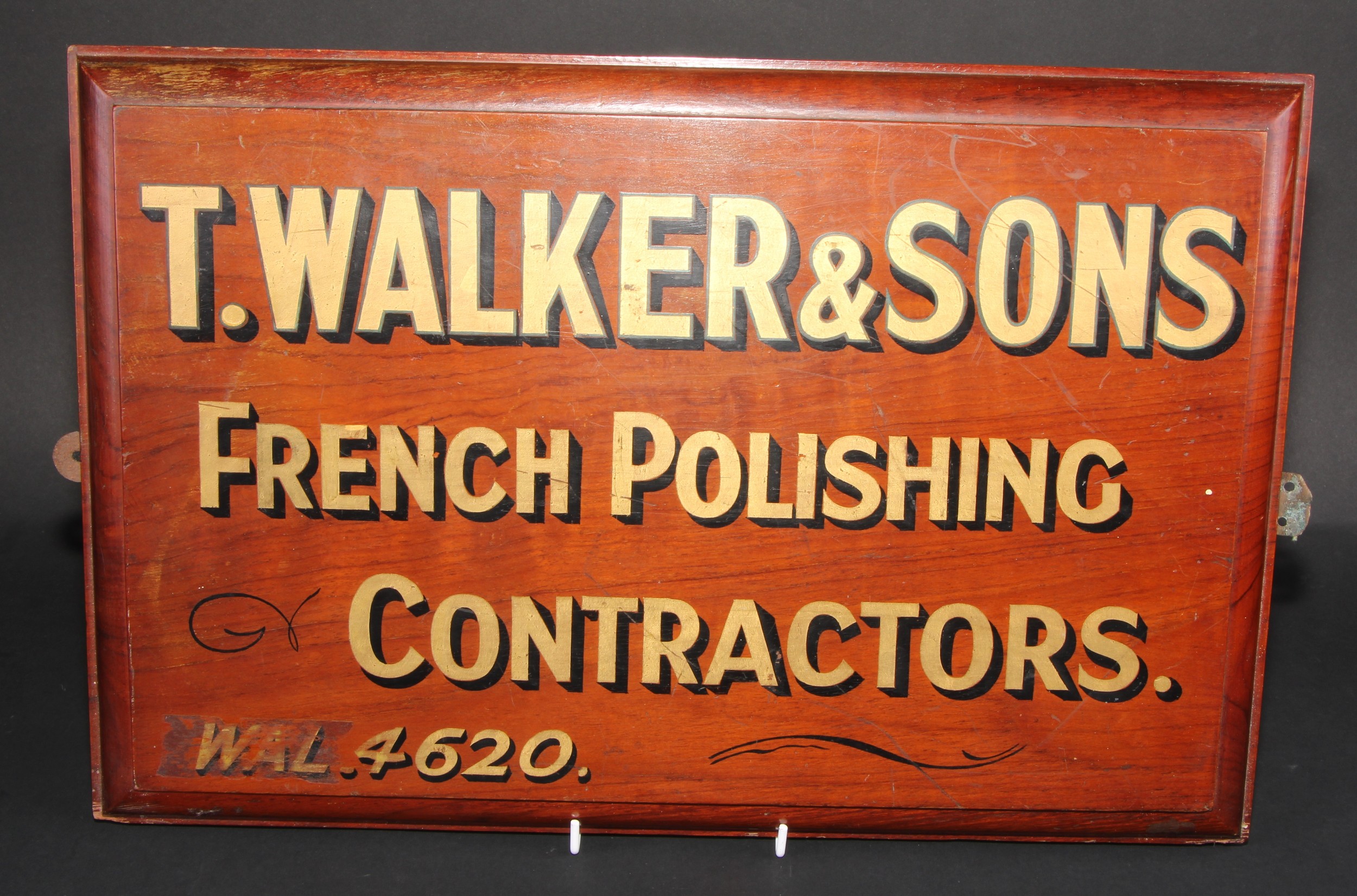 An early 20th century walnut antique restoration workshop advertising sign, inscribed in gilt T