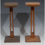 Haberdashery - a near pair of early 20th century oak shop display stands, square plateaux, square