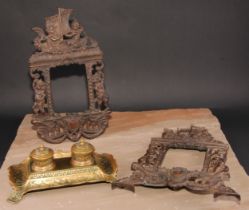 A pair of Victorian cast iron photograph frames, each crested by putti rowing a boat, 37cm high, Rd.