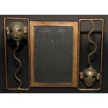 An Art Deco period painted metal easel photograph frame, the rectangular aperture flanked by African