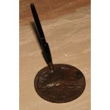 A bronze desk top pen stand, cast in relief in the Aesthetic Movement Japanese taste with a stork,