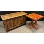 A 17th century style reproduction oak three-panel blanket chest, 58.5cm high x 107cm wide x 47cm