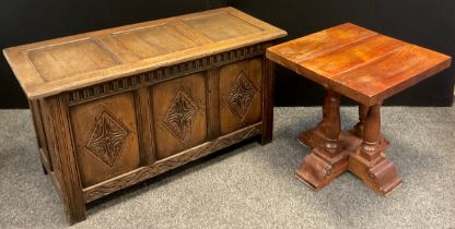 A 17th century style reproduction oak three-panel blanket chest, 58.5cm high x 107cm wide x 47cm