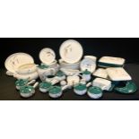 A Denby 'Green Wheat' pattern part dinner service including 10 dinner plates, eight smaller, eight