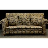 An late Victorian/early 20th century three seater drop end sofa, upholstered in deep blue and gold