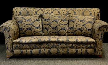 An late Victorian/early 20th century three seater drop end sofa, upholstered in deep blue and gold