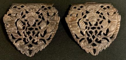 A Victorian silver belt buckle, pierced and cast with Mermaids, Cherubs and scrolling foliage,