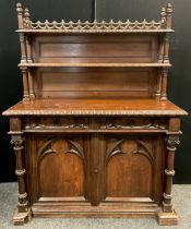 A Victorian oak Gothic Revival Chiffonier, carved and pierced three-quarter galleried top with