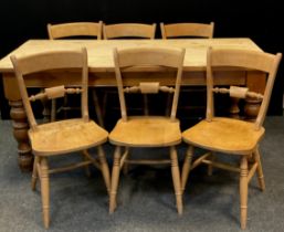 A 20th century pine kitchen table, three plank top, turned legs, 77.5cm high, 183cm long, 87.5cm