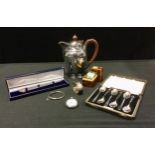 A millennium silver letter knife, two oval napkin rings, cased set of six silver tea spoons, bangle,