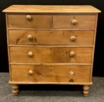 A early Victorian pine chest of drawers; over-sailing top, pair of drawers to frieze over three