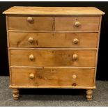 A early Victorian pine chest of drawers; over-sailing top, pair of drawers to frieze over three