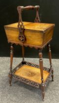 An Edwardian walnut work-box, pair of inlaid lift-up doors to top enclosing a lined interior,